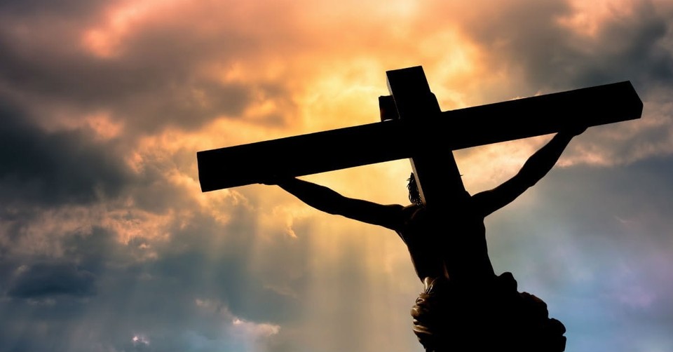 Jesus on the cross looking up at heaven.